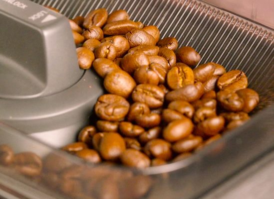 Whole beans in a built-in grinder's hopper.
