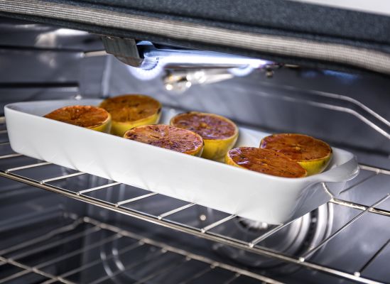 Picture taken inside an oven of a meal being cooked using the variable broil element.