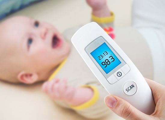 Photo of a thermometer with a lighted display.