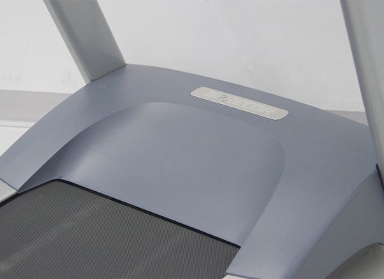 The motor housing at the front of a treadmill.