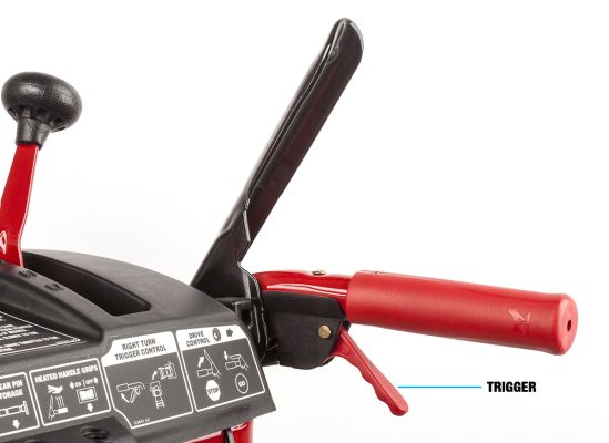 Trigger on a snow blower handle.