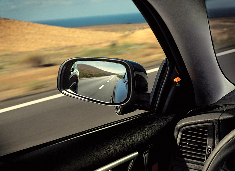 What is the way to reduce a vehicle's blind spot?
