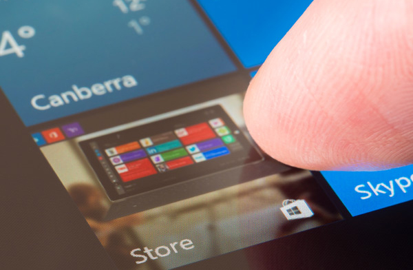 Person using their finger to navigate through a touchscreen menu.