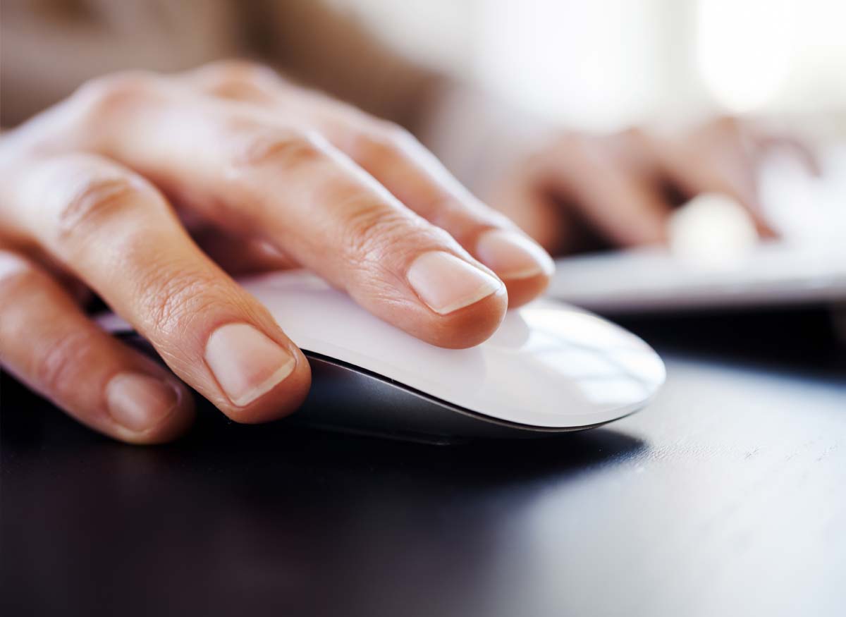 Photo of a person using a wireless mouse.