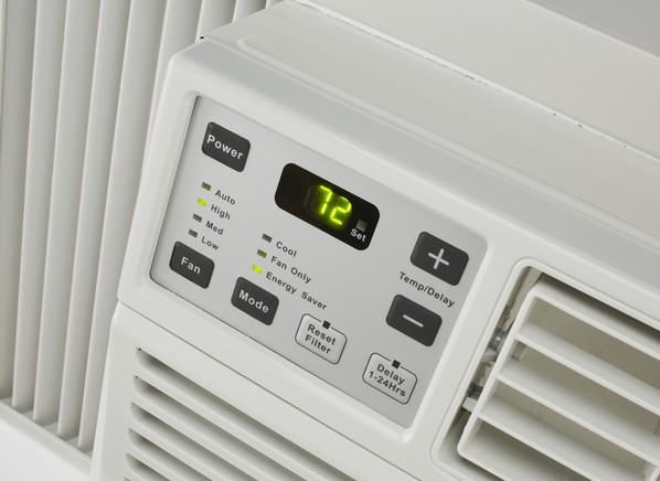 How do you determine the size of air conditioner needed in a space?