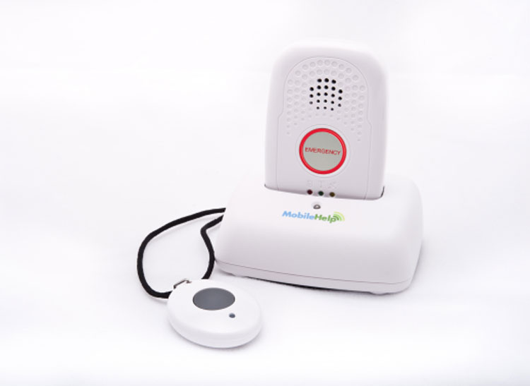 Mobile Help Solo handheld device in charger with neck pendant.