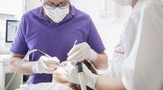 What procedures are covered by military retiree dental plans?