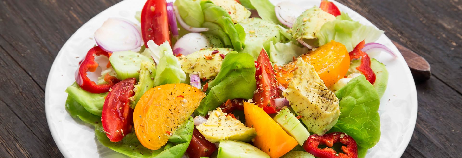 A salad made with a variety of vegetables. Salads are part of a plant-based diet. 