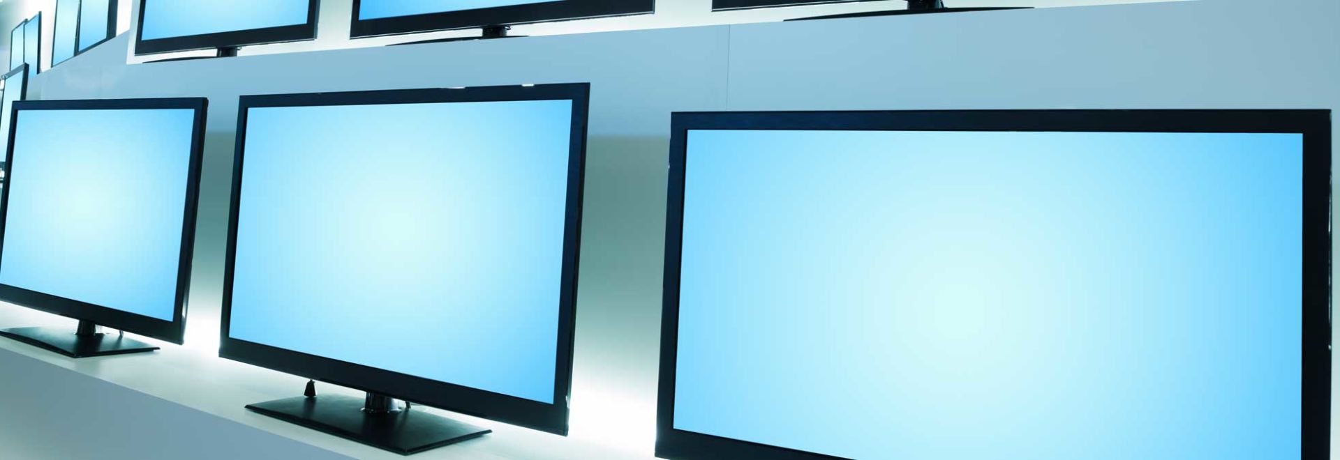 Rows of televisions, with no TV brands on them.