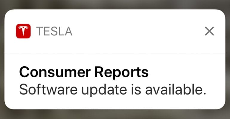 iPhone lock screen showing available update for Tesla car.