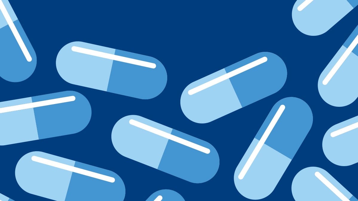 Light blue medication capsules.