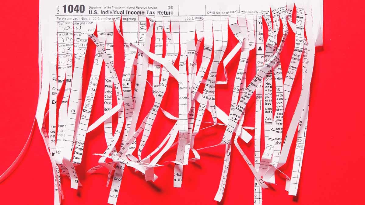 Shredded paper against a red backdrop.
