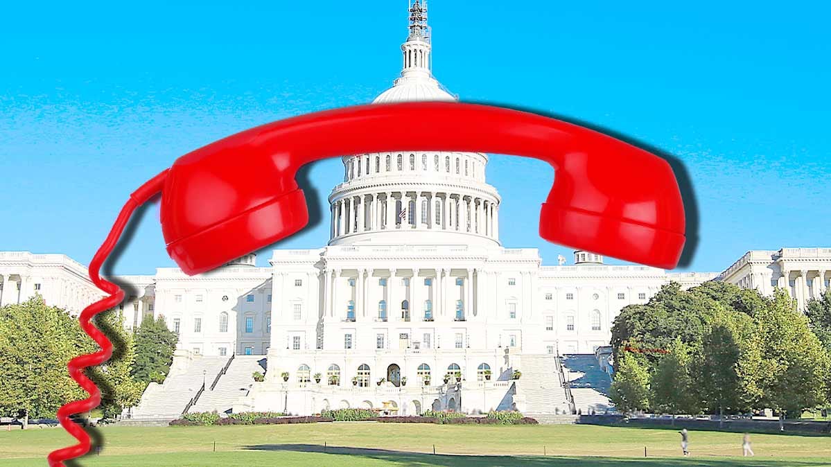 The US Capitol building with a red telephone