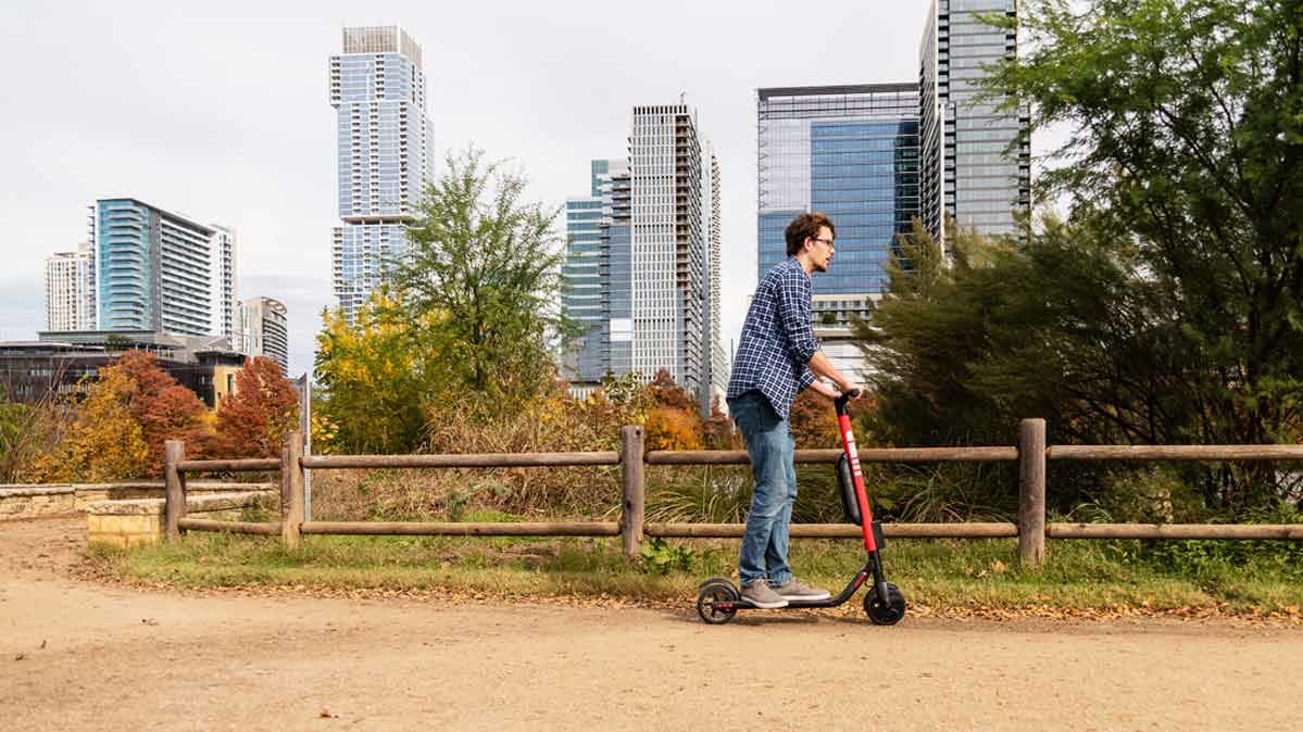 A person riding an electric scooter in Austin, Texas