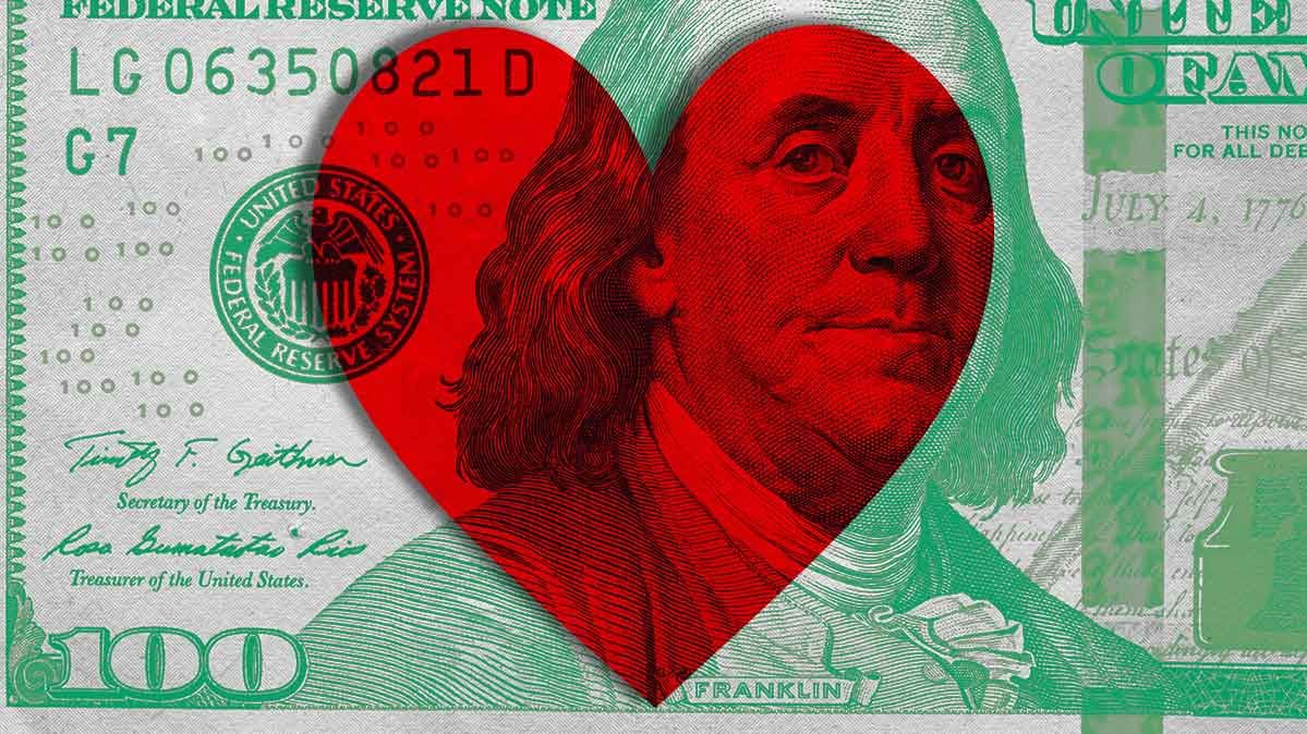 A $100 bill with a heart superimposed on it