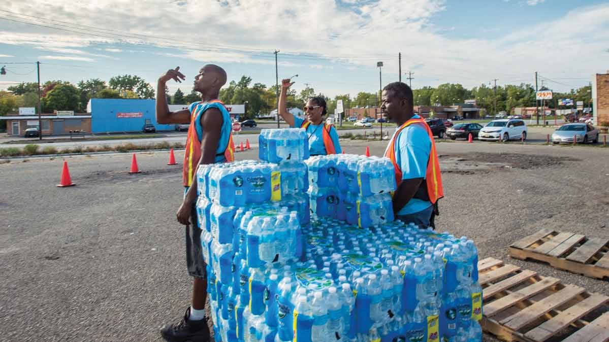 People distributing bottled water in Flint, Mich. 