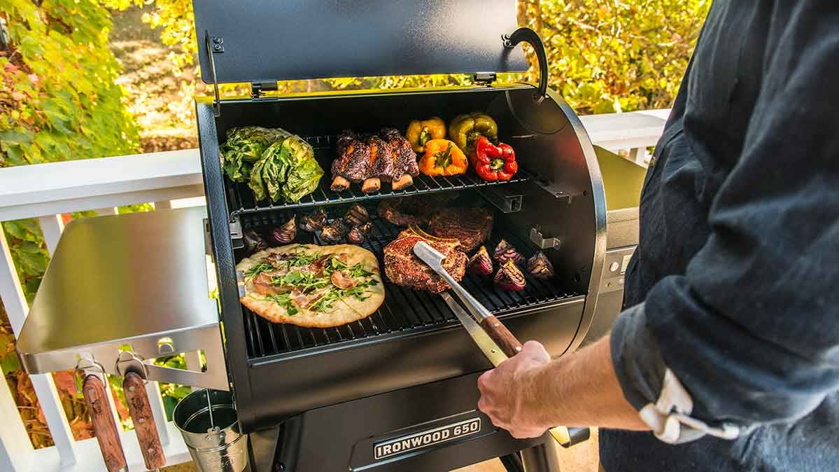 Someone grilling on a pellet grill. 