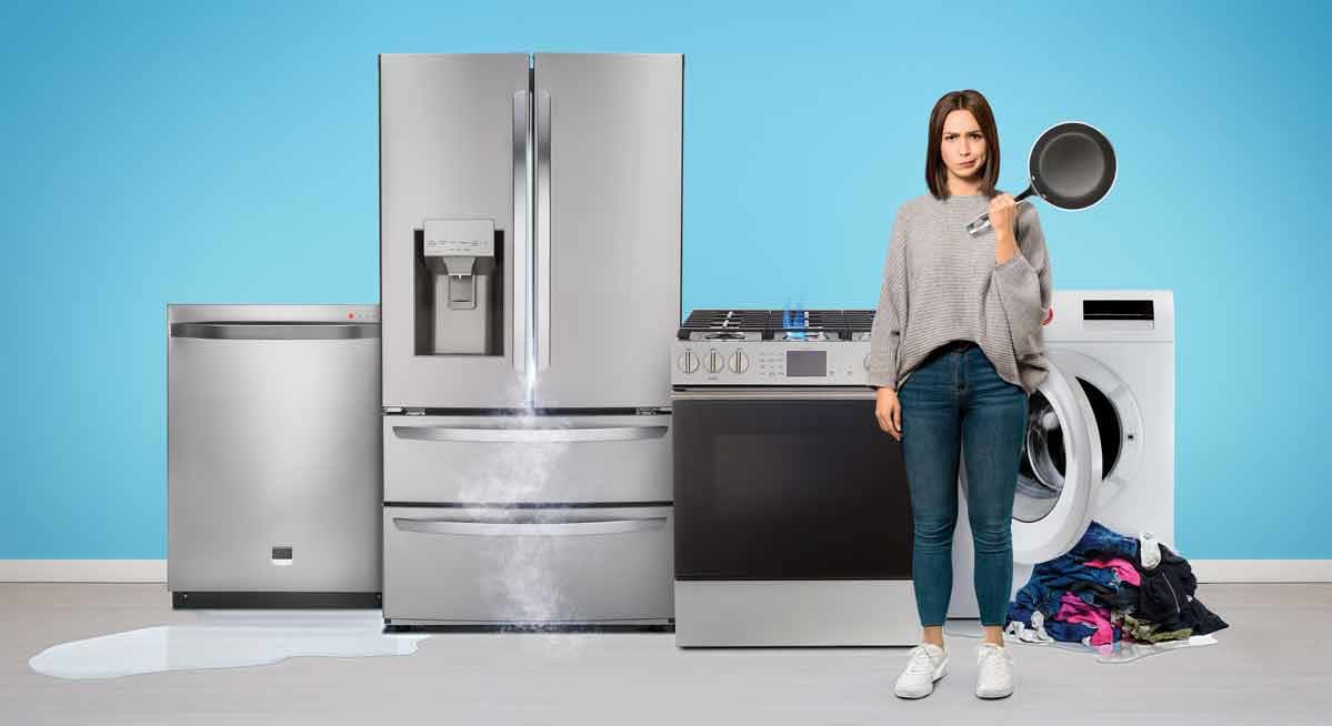 A person surrounded by several home appliances