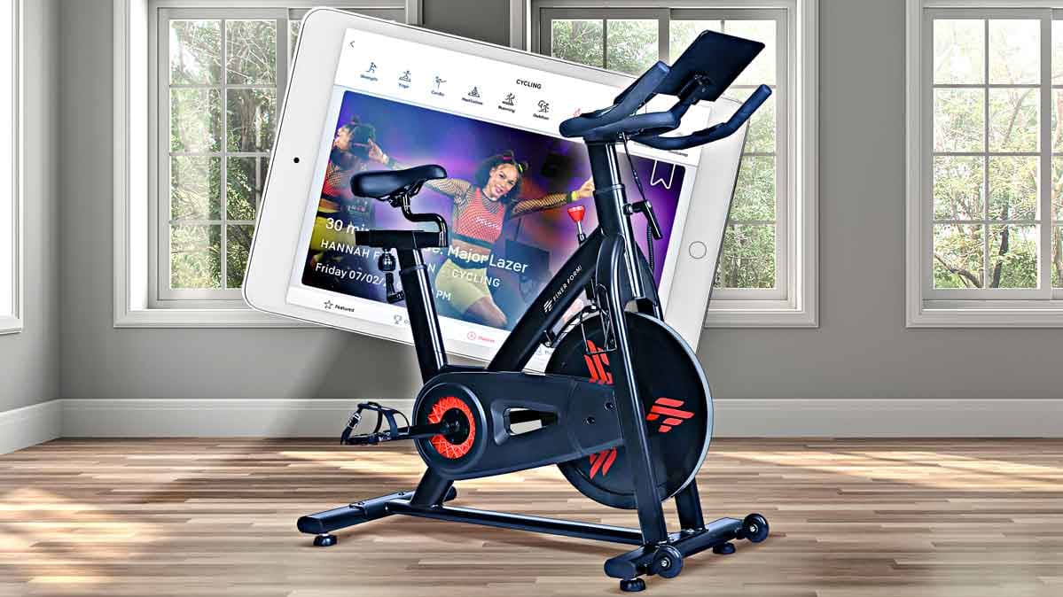 An illustration of a exercise bike in front of a tablet.