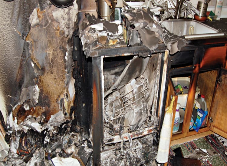The charred aftermath of a dishwasher fire.