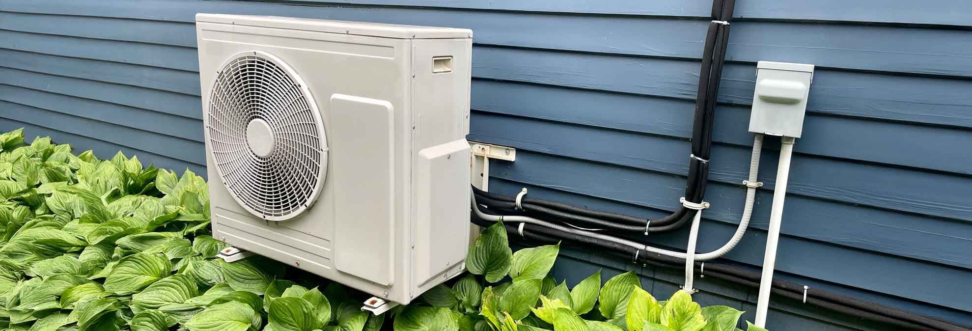 Heat pump next to house