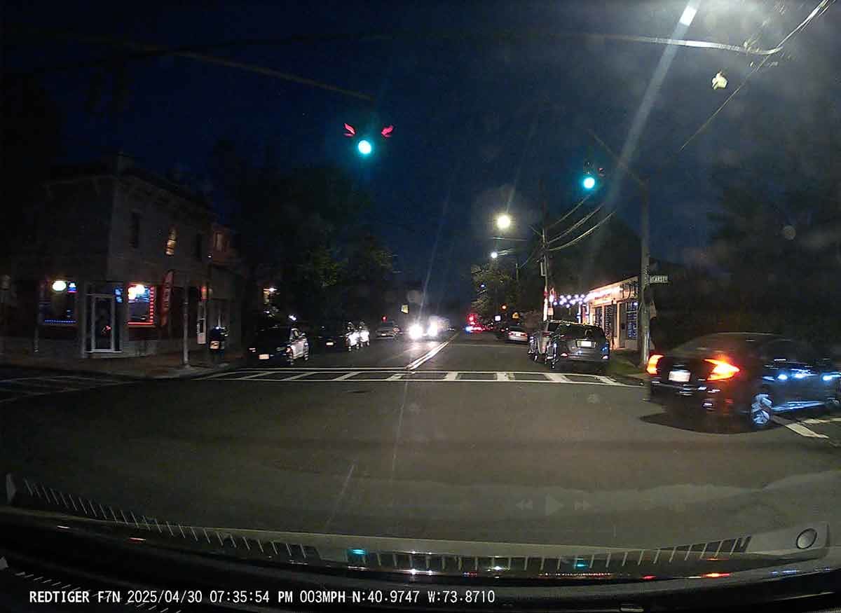 View of an intersection at nighttime from the Redtiger 4k dashcam.