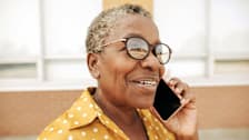 Senior woman speaking on smartphone