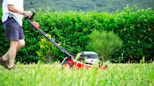 Person mowing their lawn.