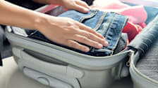 Packing a suitcase.