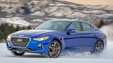 2019 Genesis G70 sedan driving through snow