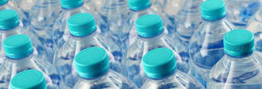 detail of grid of tops of water bottles