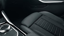 Interior of car with dark fabric seat