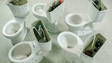 5 toilets without a tank lid being tested in a Consumer Reports lab