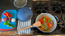 Always Pan cooking peppers on a stove