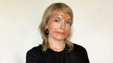 woman wearing wrinkle tape on face