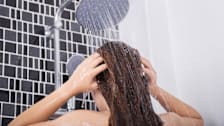 Woman washing her hair in the shower