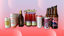 bottles and cans on pink and purple background