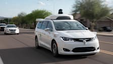 Waymo van driving in Chandler, AZ