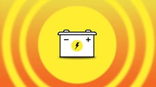 Illustration of a car battery surrounded by yellow and orange rings.