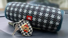 JBL speaker with personalized Porsche pattern with Porsche keychain in front of it