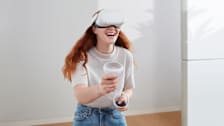 A woman playing Meta Quest 2