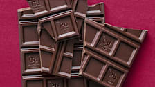 Lead and Cadmium element symbols on pieces of dark chocolate.