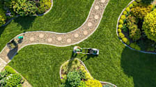 Aerial view of person mowing their lawn.