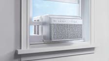 Midea U MAW08V1QWT air conditioner in window frame