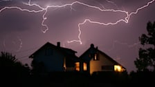 Lightning at night over house