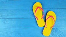 Flip Flops Yellow on blue wooden background
