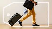 A person rolling their luggage.