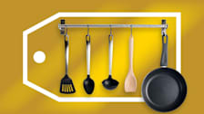 Hanging kitchen utensils and pan with a large Black Friday and Cyber Monday sales tag