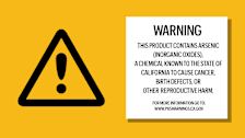 A triangle warning sign and a sign that contains a Prop 65 warning.