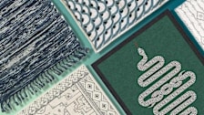 green, blue, and white patterned rugs on a green background